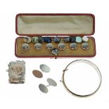 Silver vesta case, snap bangle, pair of cufflinks and a set of decorative buttons decorated with