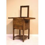 Early 19th Century mahogany washstand with hinged opening top, fitted one cupboard door with