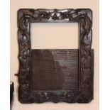 Late 19th/early 20th Century carved rosewood easel backed photograph frame having carved