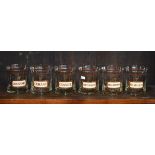 Set of six novelty tumblers having apothecary type labels together with a mirror back print