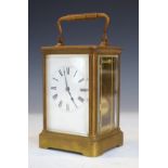Large French brass cased carriage clock, the off-white dial with Roman numerals, striking on a