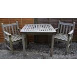 Teak square top garden table and pair of matching elbow chairs Condition: