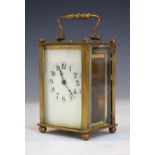 French brass cased carriage clock, the off-white dial with Arabic numerals, with outer carrying case