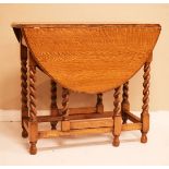 20th Century oak oval gateleg tea table raised on barley twist supports Condition: