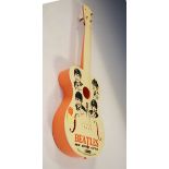 The Beatles - Plastic toy guitar by Selcol Product Ltd, in orange and cream, decorated with