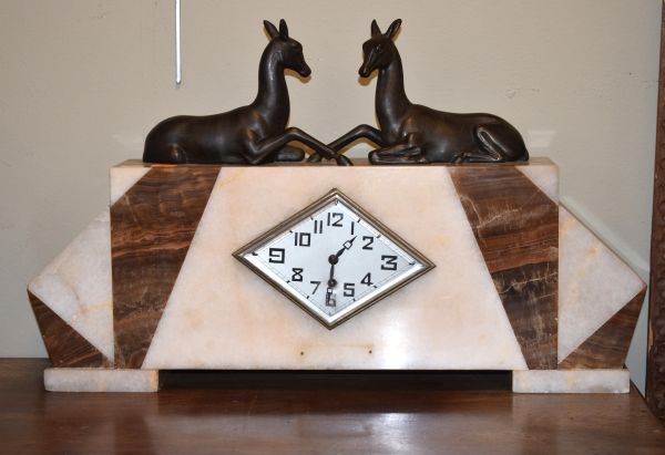 Art Deco alabaster and marble cased mantel clock having bronzed spelter figural decoration depicting