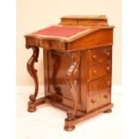 Victorian figured walnut davenport, the hinged cover revealing a satin wood lined interior