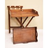 Two mahogany butlers trays, each on a folding stand Condition: