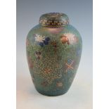 Japanese cloisonné ovoid jar and cover decorated with stylised foliage and brocade panels on a green