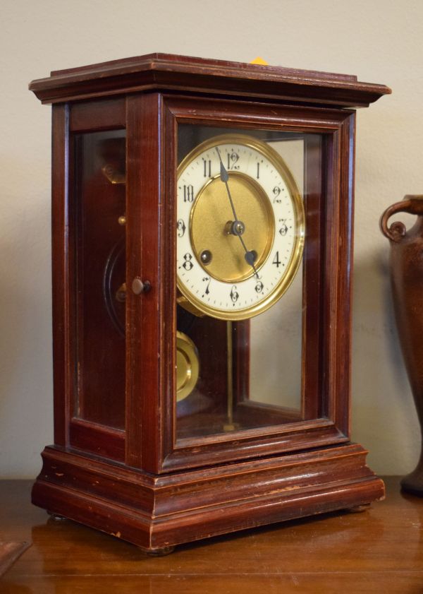 Early 20th Century stained beech cased mantel clock, the gilt dial having an off-white chapter