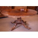 Early 19th Century mahogany and string inlaid loo table, raised on a tapered column and four