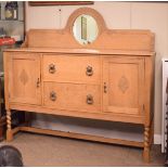 Early 20th Century light oak sideboard having mirror back, fitted two drawers flanked by cupboard