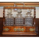 Late 19th/early 20th Century oak and silver plated mounted three bottle tantalus Condition: