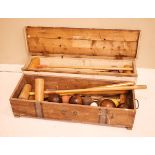 Two vintage part croquet sets and some lignum vitae bowls etc, in two wooden cases Condition: