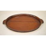 19th Century oval mahogany tea tray having scroll handles and carved rope twist border Condition: