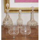 Three cut glass decanters and four cut glass finger bowls having Greek key decoration Condition:
