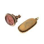 Gilt metal fob seal with engraved hardstone bird seal, together with a gilt metal oval locket having