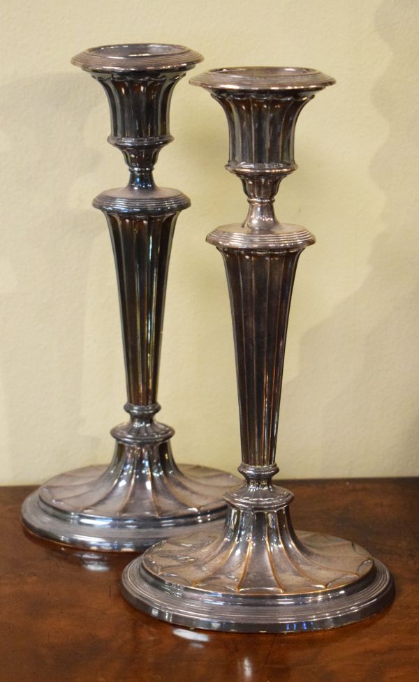 Pair of Georgian style silver plated candlesticks, each standing on an oval foot Condition: