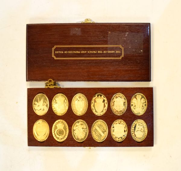 Set of twelve silver gilt oval ingots portraying the Arms of Prince and Princess of Wales,