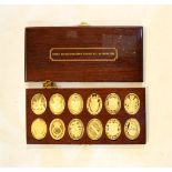 Set of twelve silver gilt oval ingots portraying the Arms of Prince and Princess of Wales,