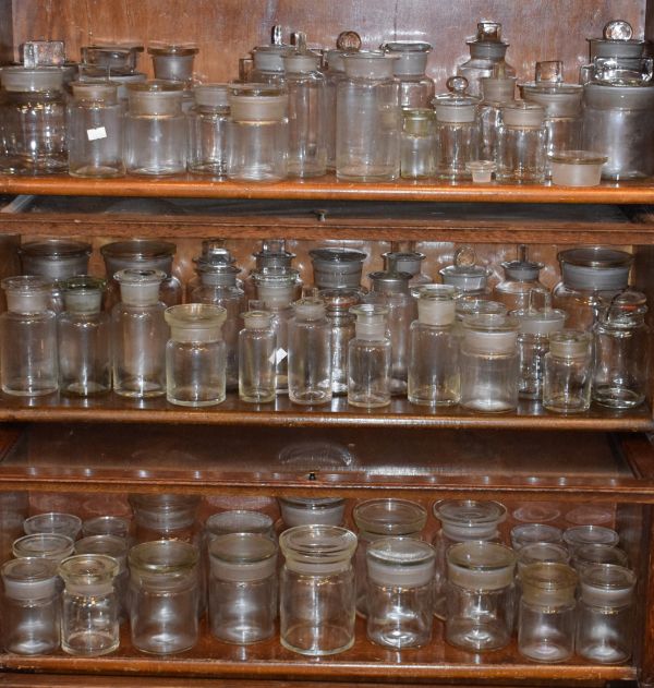 Large quantity of clear glass apothecary jars (three shelves) Condition: