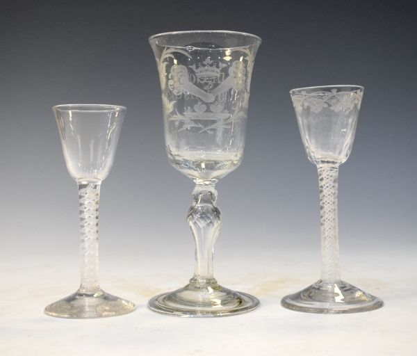 Two cotton twist cordial glasses and an engraved goblet having Flemish script and fold-over foot