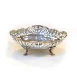 George V silver pierced oval bon bon dish raised on four scroll feet, Birmingham 1926, approx 1.