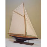 Model of a yacht on a rectangular mahogany plinth Condition: