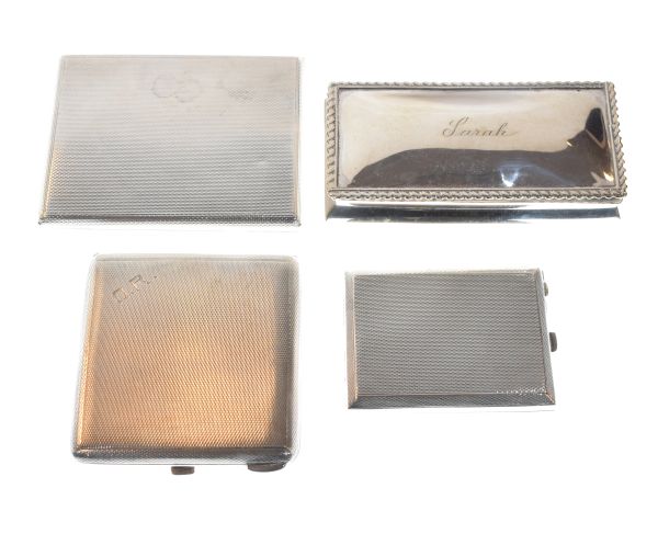 Two engine turned cigarette cases, a similarly decorated vesta holder and a silver rectangular