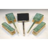 George V silver five piece engine turned pale green enamel decorated brush set, Birmingham 1933/34