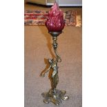 Brass Art Nouveau design figural table lamp having frosted ruby glass shade Condition: