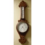 Early 20th Century carved oak cased aneroid barometer and thermometer Condition: