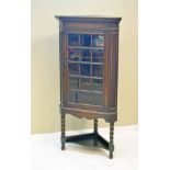 1930's period stained oak floor standing corner display cabinet, fitted one door Condition: