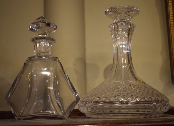 1920's design facet cut glass decanter, together with a cut glass ships decanter Condition: