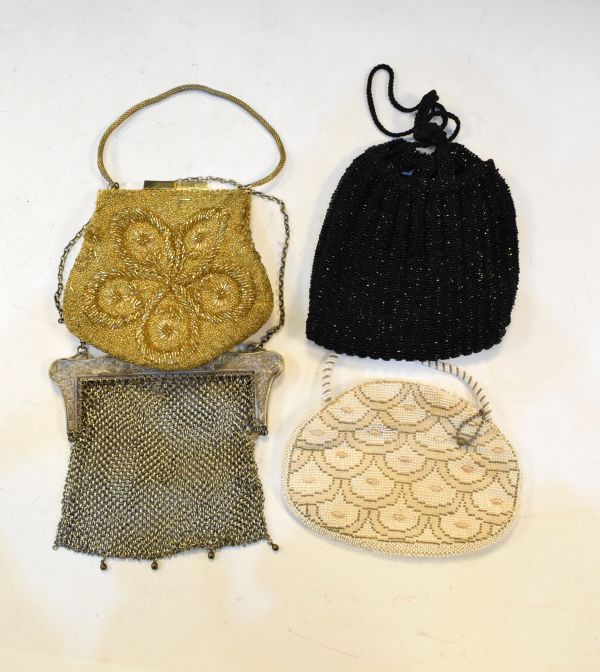 Three lady's beadwork evening bags and a silver plated chainmail purse Condition: