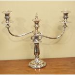 Silver plated two branch candelabra standing on a fluted baluster column and floret shaped foot
