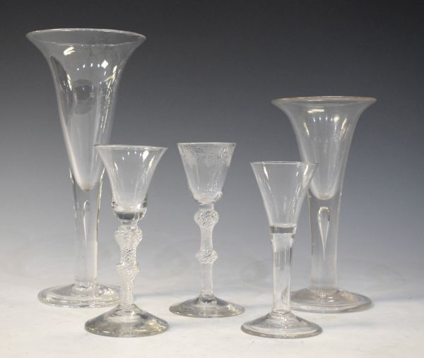 Five various Georgian design clear glass wines, two having air twist stems Condition: