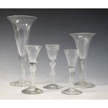 Five various Georgian design clear glass wines, two having air twist stems Condition: