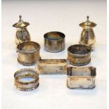 Quantity of silver napkin rings, one stamped sterling and a pair of silver baluster shape