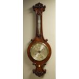 Victorian carved walnut cased wheel barometer and thermometer by West of London, having an