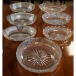 Set of three early 19th Century good quality heavily cut glass oval dishes, three others and a