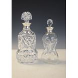 Two cut glass decanters, each having a silver collar, Birmingham 1909 and Birmingham 1934 Condition: