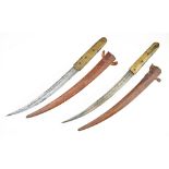 Two Moroccan daggers 'Shula', the first with curved single edged blade 32cm, with line decoration,