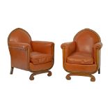 Pair of Art Deco beech framed easy armchairs, upholstered in brass studded tan hide Condition:
