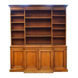 Victorian mahogany breakfront two section bookcase, the open upper section fitted four central