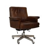 Modern Design - De Sede swivel desk/office chair upholstered in brown leather and standing on a