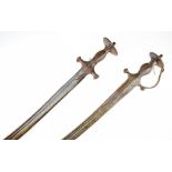 Two Indian swords Tulwar, the first of all steel construction, grip of characteristic form with disc