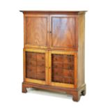 19th Century mahogany estate cupboard, the upper section fitted shelves and pigeon holes enclosed by