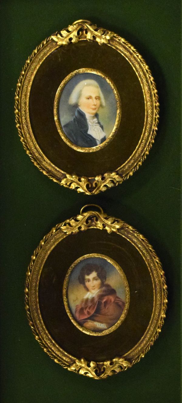 Pair of oval portrait miniatures - Gentlemen in period costume, each in a decorative gilt metal