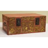 20th Century Oriental trunk having hinged cover, the red lacquer effect finish with blind fretwork